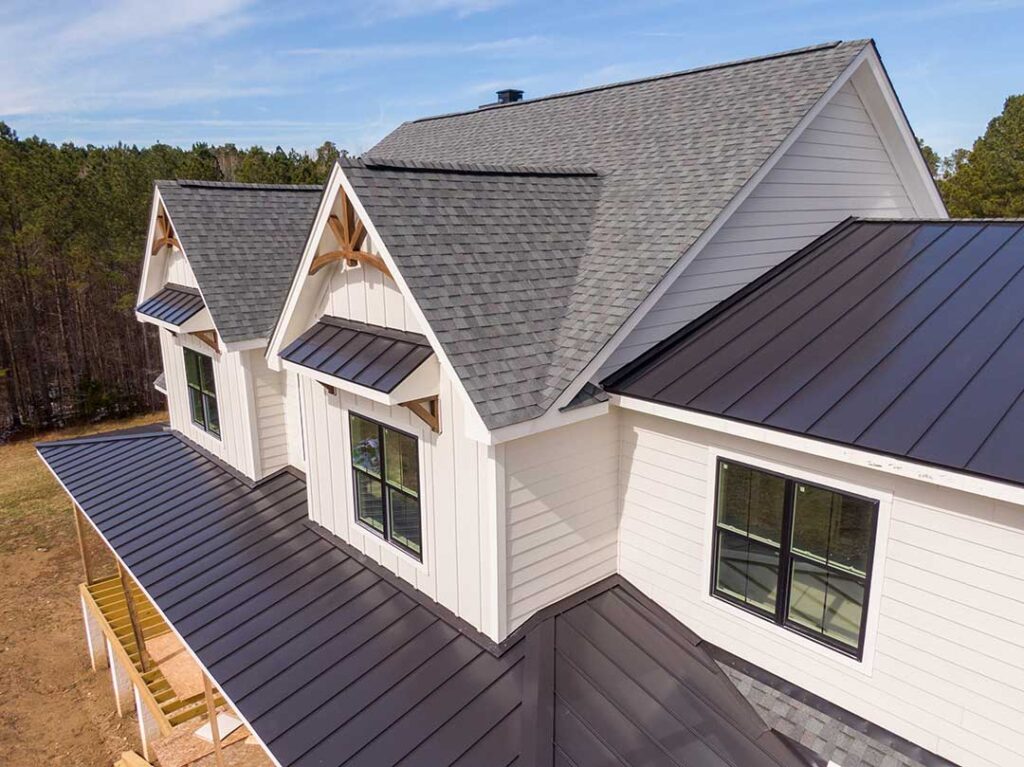 Sunlit asphalt shingles show fading and granule loss on a residential roof slope.