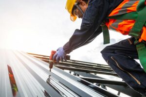 A homeowner reviews a detailed roofing estimate with a contractor beside a residential roof inspection.